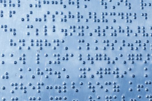 background of metal sheet with braille dots