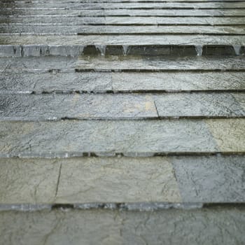 water flowing down on tiles