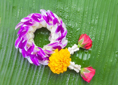 Orchid garland on a banana leaf