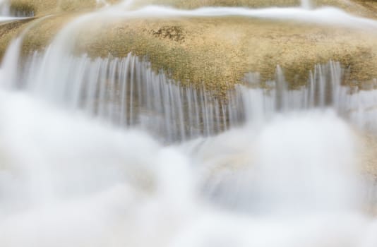 water flowing down from the rocks