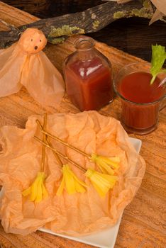 Halloween party snack decorated for children, cheese broomsticks