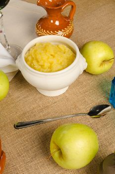 A bowl of homemade Hanukkah apple sauce  with its main ingredient