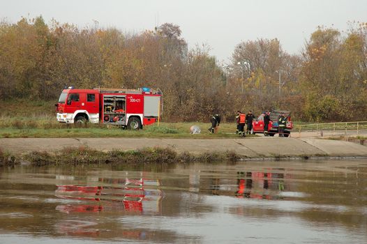 POZNAN, POLAND - OCTOBER 25: Fire brigade exercises on Warta river bank in Poznan Poland 25.10.2013