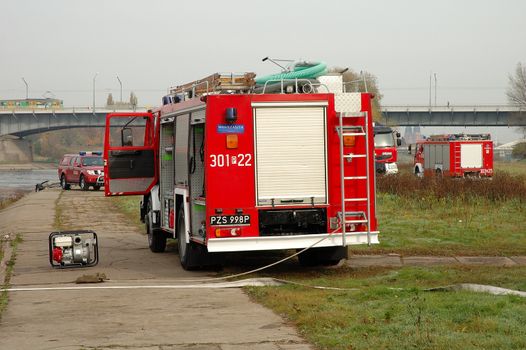 POZNAN, POLAND - OCTOBER 25: Fire brigade exercises on Warta river bank in Poznan Poland 25.10.2013