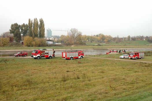 POZNAN, POLAND - OCTOBER 25: Fire brigade exercises on Warta river bank in Poznan Poland 25.10.2013