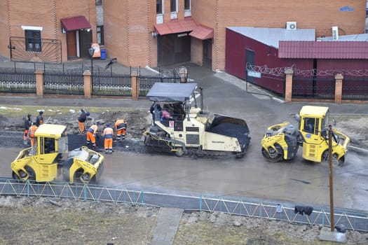 Special equipment on repair of roads. Bulldozer, asphalt spreader.