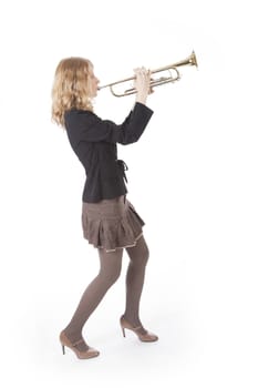 young smartly dressed woman playing the trumpet against white background