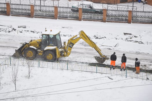 Special equipment on road construction. Snowfall.