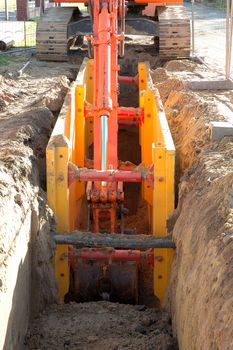  Digger shovel inside ditch during work