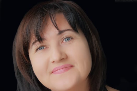 Portrait of woman with blue eyes and black hair