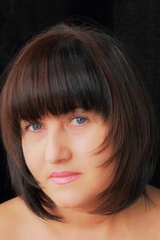 Portrait of woman with blue eyes and black hair