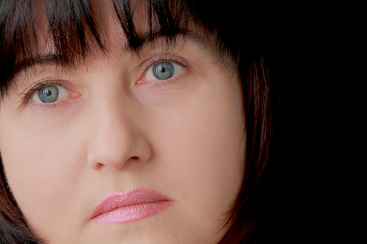 Portrait of woman with blue eyes and black hair