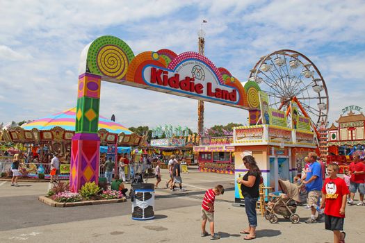 INDIANAPOLIS, INDIANA - AUGUST 12: Entrance to Kiddie Land and rides on the Midway of the Indiana State Fair on August 12, 2012. This very popular fair hosts more than 850,000 people every August.