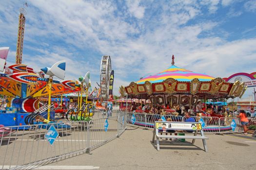 INDIANAPOLIS, INDIANA - AUGUST 12: The carousel and other rides on the Midway at the Indiana State Fair on August 12, 2012. This very popular fair hosts more than 850,000 people every August.