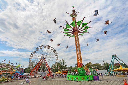 INDIANAPOLIS, INDIANA - AUGUST 12: The ferris wheel and other rides on the Midway at the Indiana State Fair on August 12, 2012. This very popular fair hosts more than 850,000 people every August.