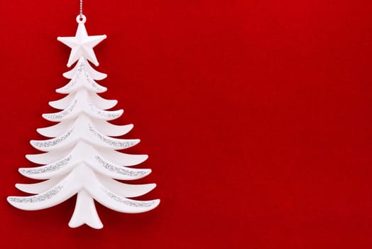 Christmas tree on a background of red velvet paper