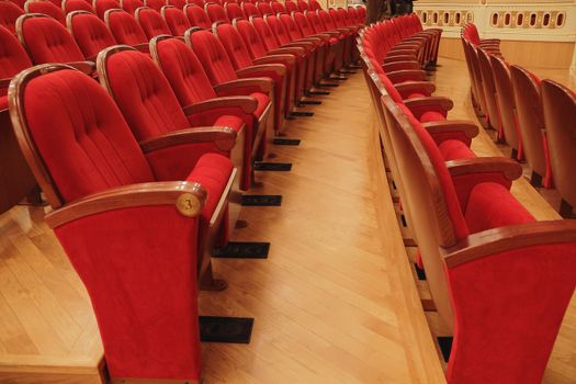 Background of many red theatrical red chairs