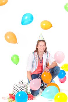 a birthday girl with presents and balloons on a white background