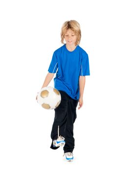 a young boy playing soccer on a white background