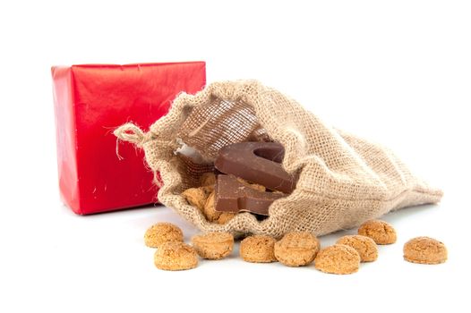 A jute bag full of pepernoten, for celebrating a dutch holiday " Sinterklaas "  on the fifth of December