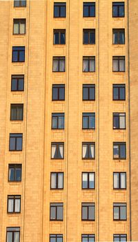 The windows in the wall of a large house