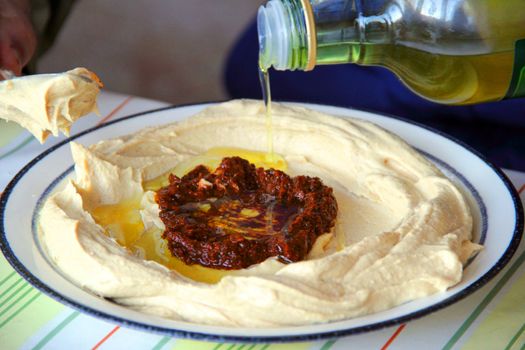 preparation of hummus  on dish