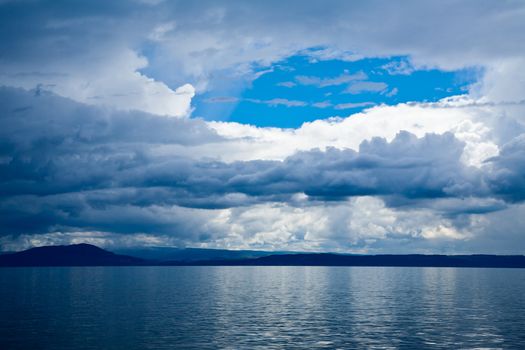 Moody sky with stormy clouds over Lake Taupo in the North Island of New Zealand