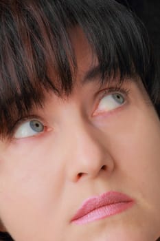 Portrait of woman with blue eyes and black hair
