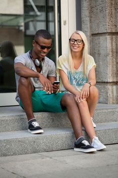 happy young couple have fun in the city summertime outdoor smiling lifestyle