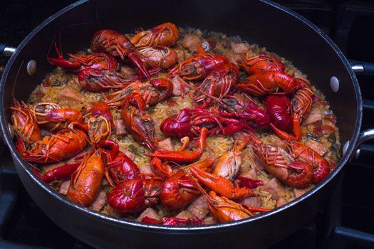 A beautiful skillet full of crawfish jambalaya. This dish was created in the southern United States, in Lousiana.