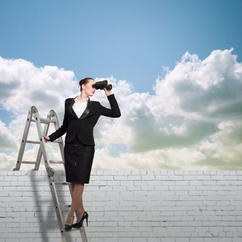 businesswoman climbed a ladder and looking through binoculars