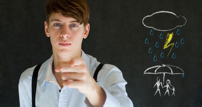 Insurance businessman protecting family from natural disaster on blackboard background