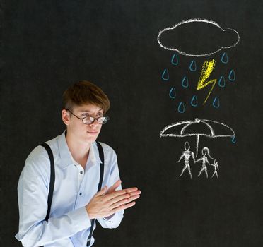 Insurance businessman protecting family from natural disaster on blackboard background