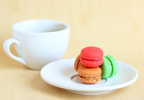 Colorful macaroons and a cup of coffee