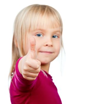 Portrait of cute little girl showing thumb up on white background