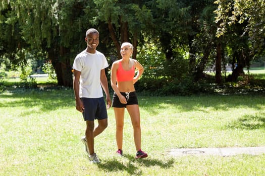 young couple runner jogger in park outdoor summer sport lifestyle 