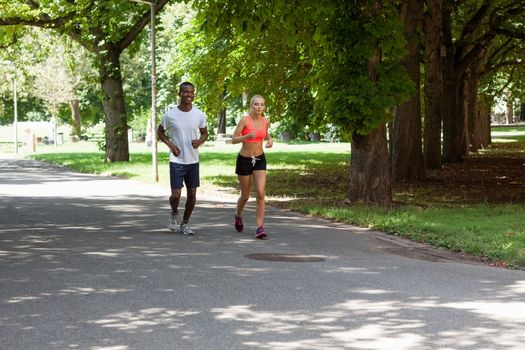 young couple runner jogger in park outdoor summer sport lifestyle 