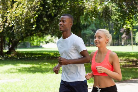 young couple runner jogger in park outdoor summer sport lifestyle 