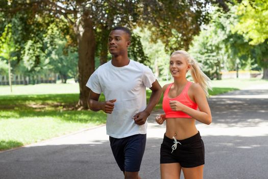 young couple runner jogger in park outdoor summer sport lifestyle 