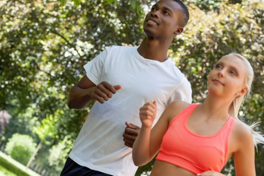 young couple runner jogger in park outdoor summer sport lifestyle 