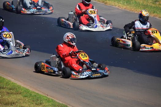 Eastern Creek, Australia - 29 October, 2013:  Kart racing motorsport at Eastern Creek International Karting Raceway , Australia. Karts can reach speeds up and over 140km per hour.  Focus to Kart and racer 56