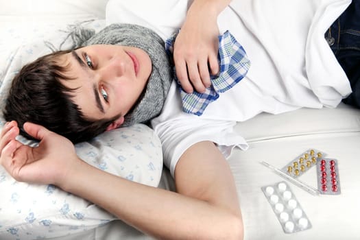 Diseased Young Man lying on the Bed