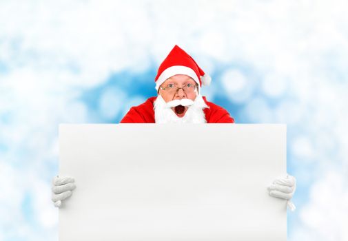Surprised Santa Claus with Blank Board on the Abstract Winter Background