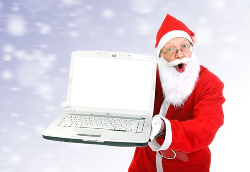 Surprised Santa Claus with Laptop on the Abstract Winter Background