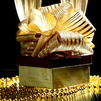 holiday card golden champagne and gift