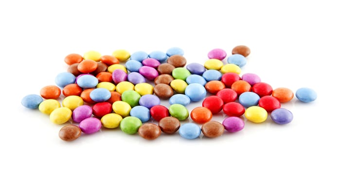 pile of colorful candy over white background