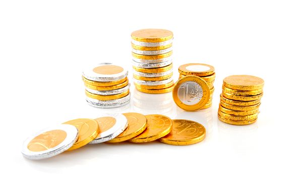 pile of chocolate euro money over white background