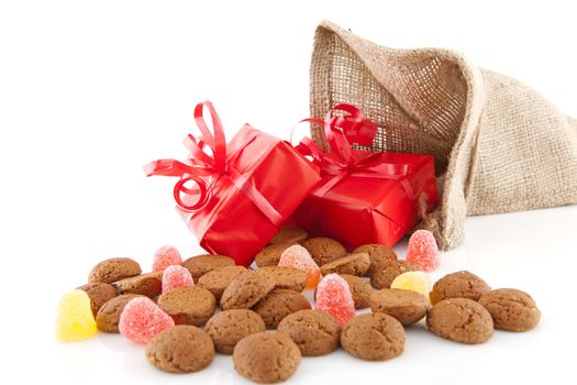 Typical Dutch celebration: Sinterklaas with surprises in bag and ginger nuts, ready for the kids in december. Isolated on white background