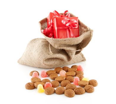 Typical Dutch celebration: Sinterklaas with surprises in jute bag and ginger nuts, ready for the kids in december. Isolated on white background
