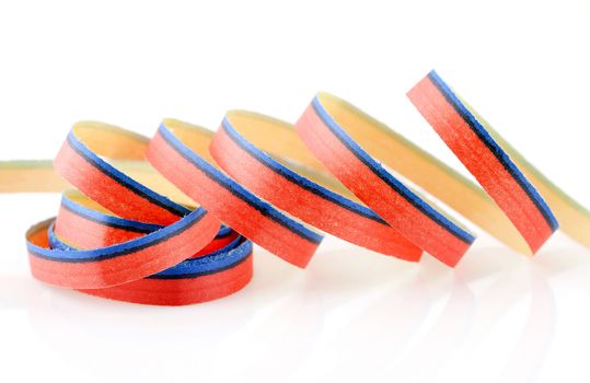 Curly party streamer in closeup over white background